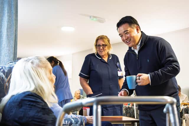 Alan Mak MP talks to a resident at Cross Way House Care Home in Havant