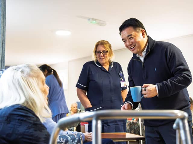 Alan Mak MP talks to a resident at Cross Way House Care Home in Havant