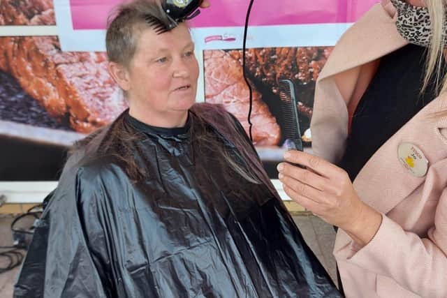 Carole Runalls, who works at Tesco in Whitely had her head shaved as part of a fundraiser for Cancer Research UK 