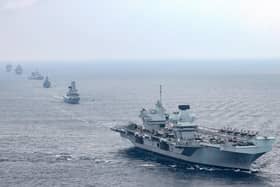 Pictured: From front to back are HMS Queen Elizabeth, HMS Defender, HMS Richmond, HNLMS Evertsen, RFA Tidespring and RFA Fort Victoria in formation ready to wave off USS The Sullivans.