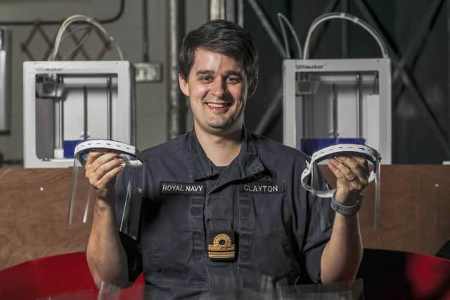 Lieutenant Andrew Clayton showing some of the face shields made for frontline workers at HMNB Portsmouth. Picture: LPhot Barry Swainsbury