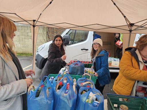 Volunteers handing out packages at the Mobile Foodbank.