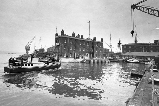 A boat arrives near King's Stairs at the dockyard, October 1975. The News PP1193