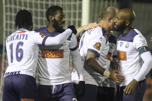 Hawks celebrate Roarie Deacon's FA Trophy winner against Braintree. Pic: Kieron Louloudis.