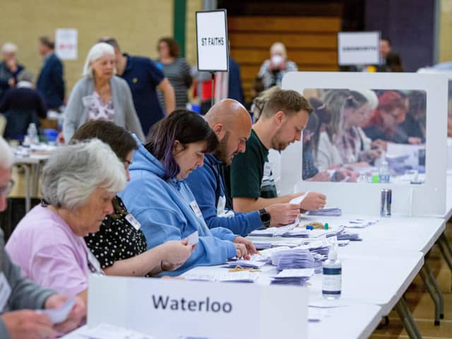 Local election count at Havant Leisure Centre, Havant on Friday 6th May 2022Pictured: People countingPicture: Habibur Rahman