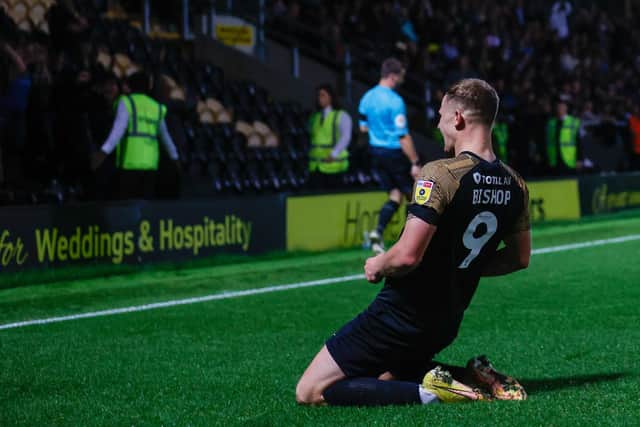 Colby Bishop celebrates his goal at Burton.