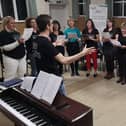 Encore Choirs, based in Petersfield and Farnham, are run by Portsmouth resident Josh Robinson and his fiancee Gemma Ford. Pictured: A choir group performing together before they had to meet online