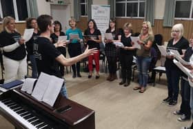 Encore Choirs, based in Petersfield and Farnham, are run by Portsmouth resident Josh Robinson and his fiancee Gemma Ford. Pictured: A choir group performing together before they had to meet online