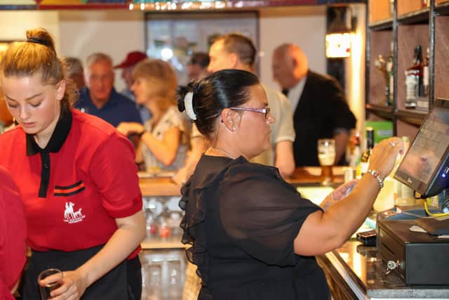 Staff of the newly refurbished Hunters Inn hard at work serving a full house.
Photo by Alex Shute