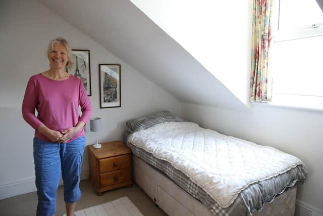 Judy Walker in one of the spare bedrooms that will house a Ukrainian family.
