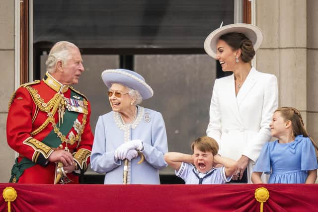 Britain's Prince Charles, Queen Elizabeth II, Prince Louis, Kate, Duchess of Cambridge and Princess Charlotte stands on the balcony of Buckingham Palace after the Trooping the Color ceremony in London, Thursday, June 2, 2022, on the first of four days of celebrations to mark the Platinum Jubilee. (Aaron Chown/Pool Photo via AP).