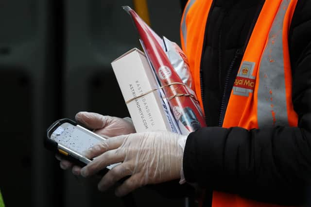 Royal Mail workers are offering to be an 'additional emergency service'. Picture: AP Photo/Frank Augstein