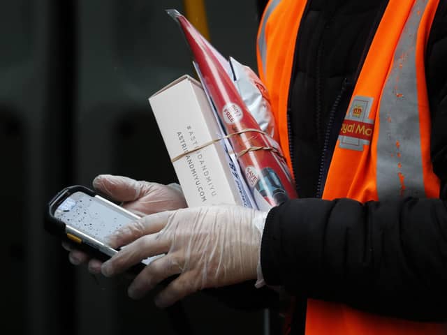 Royal Mail workers are offering to be an 'additional emergency service'. Picture: AP Photo/Frank Augstein