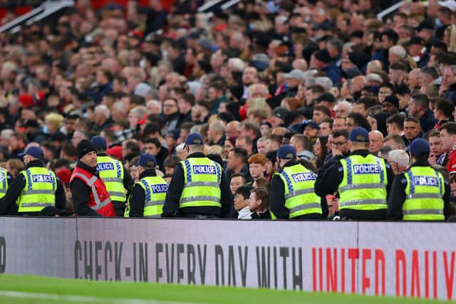 Police are seen inside the stadium during the Premier League match between Manchester United and Chelsea at Old Trafford on April 28, 2022 in Manchester, England. Photo by Alex Livesey/Getty Images