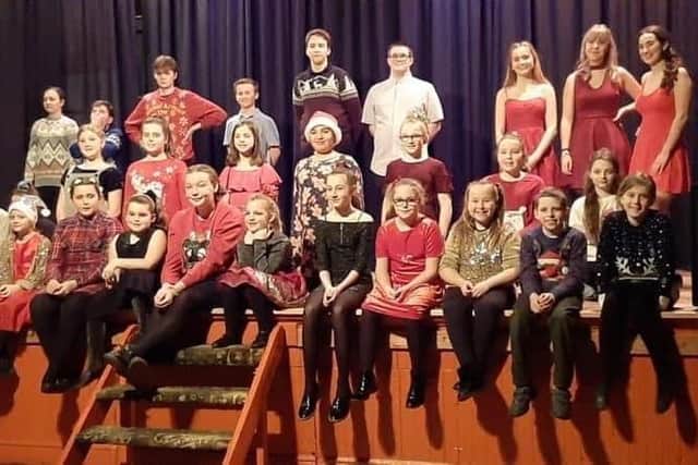 Performers from South Down Stage School in Waterlooville have starred in a video singing rewritten lyrics to Islands in the Stream as a thank you to NHS staff and key workers. Pictured: Students performing in the Christmas showcase