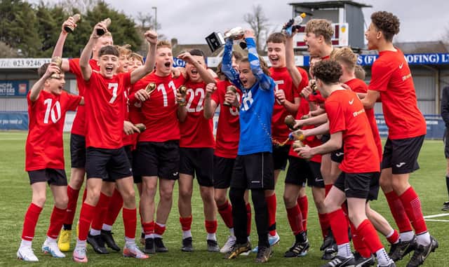 Horndean Youth Red celebrate winning the Under-14 Memorial Challenge Cup. Picture: Mike Cooter