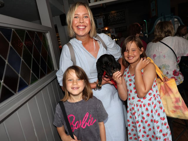 Re-opening of Eldon Arms with new owners and menu aiming to keep costs low for the punters and diners. With food supplied from O'solemio in Port SolentPictured is Louisa Jarvis with daughters Martha, 7, and Tilly, 8 and their dog Frankie.Pictured is action from the event.Sunday 9th July 2023.Picture: Sam Stephenson.