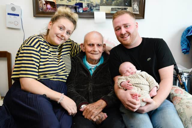 Pictured is: Emily, Michael, and Lewis Howes with son Edison.Picture: Keith Woodland (291021-17)