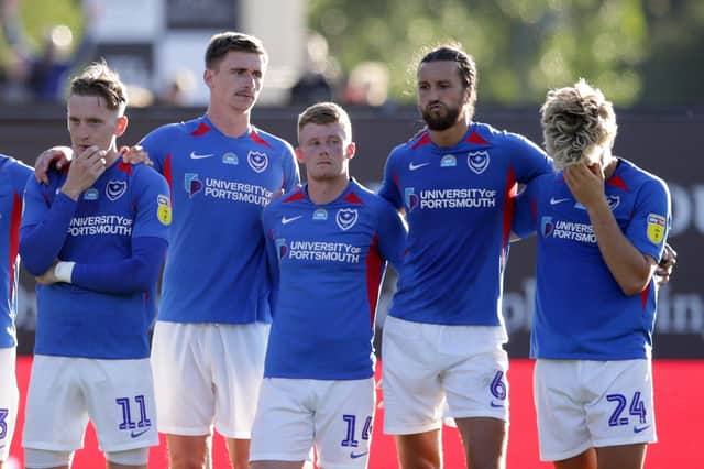 Christian Burgess, second from right, suffered play-off heartache with Pompey last season.  Picture: Robin Jones/Getty Images