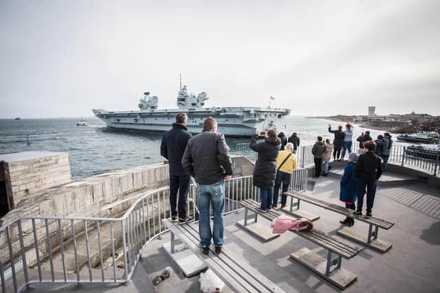 Crowds gather at The Round Tower to watch HMS Queen Elizabeth.
Picture: Habibur Rahman