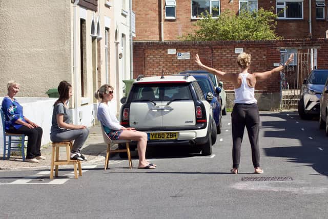 Maxine Bailey-Green leading socially-distanced yoga sessions in Wilton Terrace, Southsea. Picture by James Wileman