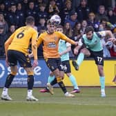 Joe Rafferty in the thick of the action against Cambridge United in March 2023, despite suffering from a broken nose. Picture: Jason Brown/ProSportsImages