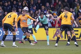 Joe Rafferty in the thick of the action against Cambridge United in March 2023, despite suffering from a broken nose. Picture: Jason Brown/ProSportsImages