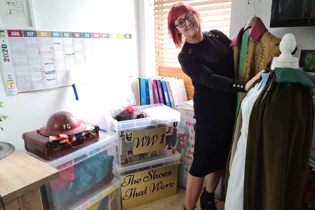 Rachel Goodall, from Milton, aims to bring some fun back into care homes with her boxes full of activities. Pictured: Rachel with some of the costumes and boxes
