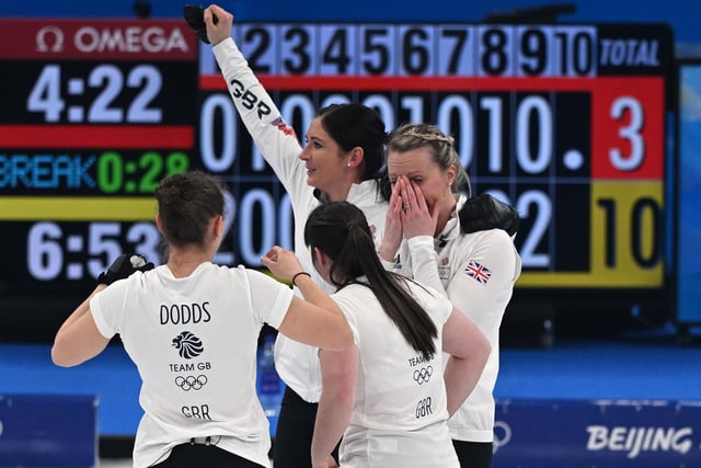 Jenn Dodds, Hailey Duff, Eve Muirhead and Vicky Wright celebrate after winning the gold