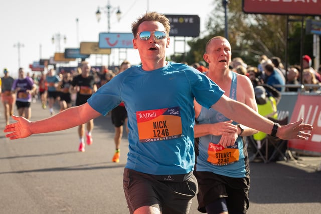 Pictured is: Runners cross the line to finish
Picture: Keith Woodland (151021-640)