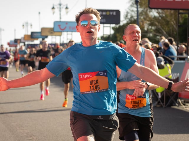 Pictured is: Runners cross the line to finish
Picture: Keith Woodland (151021-640)