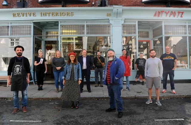 A section of Castle Road in Southsea, has been pedestrianised to allow for social distancing. Many traders are happy with the atmosphere this has created and believe it is a safer, better shopping experience for customers as a result.Pictured is: (front middle) Pete Codling with Castle Road traders.Picture: Sarah Standing (011020-4741)
