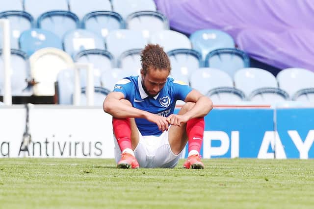 Marcus Harness dejected after Pompey failed to make the League One play-offs following defeat to Accrington. picture: Joe Pepler