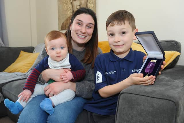 Adam Newman (5) with his mum Lauren Newman (25) and brother Peter (7 months old). Picture: Sarah Standing (040322-266)