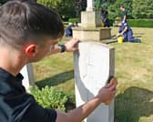 Personnel from HMS Sultan cleaning Commonwealth War Graves at St Ann’s Hill Cemetery. PictureL Royal Navy.