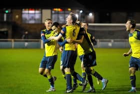 Substitute Evan Harris, second left, is mobbed by his Moneyfields team-mates after netting in the Blackfield & Langley victory Picture: Dave Bodymore