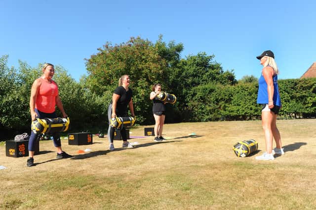 The Ladies Only Bootcamp at The Health & Fitness Barn Hampshire in Titchfield.

Pictured is: (l-r) Sam Barnes from Sarisbury Green, Annie Blake from Locks Heath and Kimberley Barber from Swanmore during the boot camp with (right) coach Beckie Gill.

Picture: Sarah Standing (070820-2267)