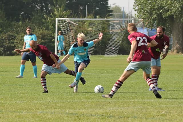 Warren Wanderers (blue) v Cross Keys. Picture by Kevin Shipp.