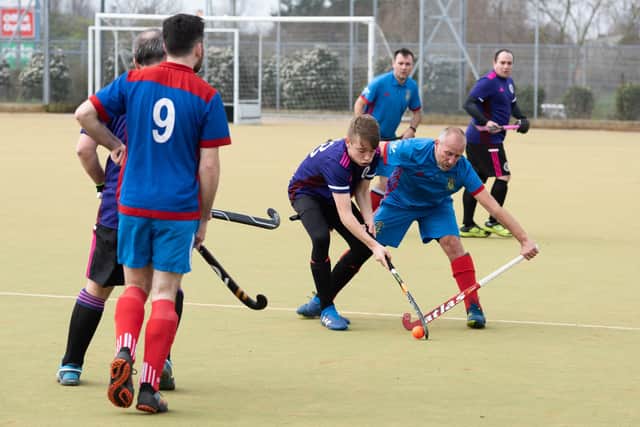 Portsmouth's Ryan Rochester (purple) and US Portsmouth's Chris Parry. Picture: Duncan Shepherd
