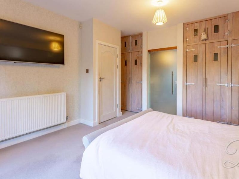Here's another view of the master bedroom, showing the wardrobes. There is lots of room to move around on the carpeted floor.