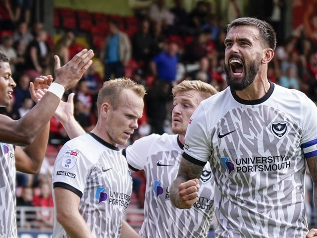 The Pompey players celebrate in front of the Blues' supporters at Brisbane Road. Picture: Jason Brown.
