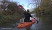 Police kayak to reach a drink-driver whose car got stuck in floodwater 