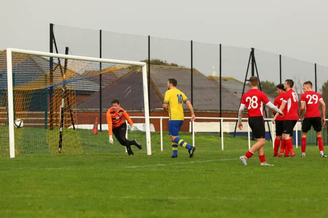 Frank Large, out of picture, scores Meon's first goal. Picture: Chris Moorhouse