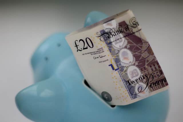 Money in a piggy bank. Picture: Gareth Fuller/PA