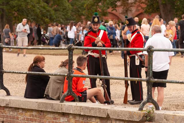 Pictured is: Members of the Cumberland Guard chat with visitors.

Picture: Keith Woodland (110921-176)