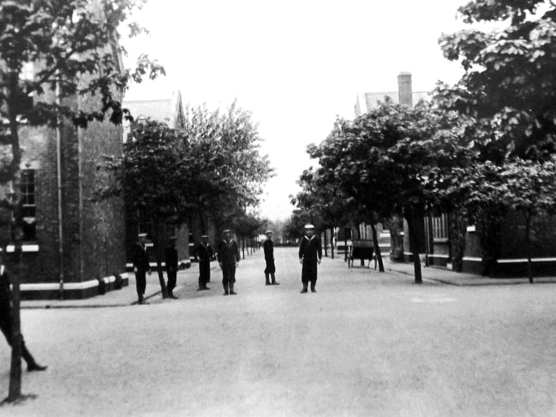 Seamen’s  blocks, HMS Excellent Whale Island. Young seamen gunners standing outside their mess blocks in HMS Excellent, Whale Island.