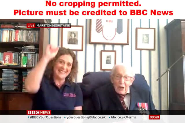 Screengrab from BBC News of Hannah Ingram-Moore with her father Captain Tom Moore, a 99-year-old veteran as they were told he has raised over 5 million pound for the NHS after setting himself a challenge to walk 100 lengths of his garden. Picture: BBC News/PA Wire