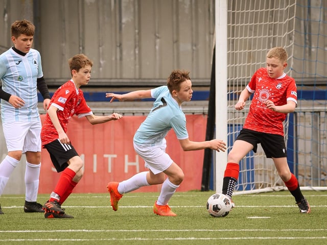 Action from the Portsmouth Youth League Geldard Invitation Cup final between Jubilee 77 U13s and Castle United U13s (light blue and white kit). Picture: Keith Woodland (190321-613)