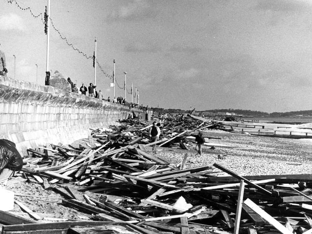 Southsea Seafront is covered with the remains of nearby buildings, such as the arcade. A Space Invaders machine lies on the beach in October 1987. The News PP4123