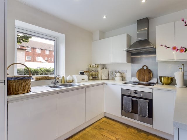 The kitchen comes fitted with modern appliances.